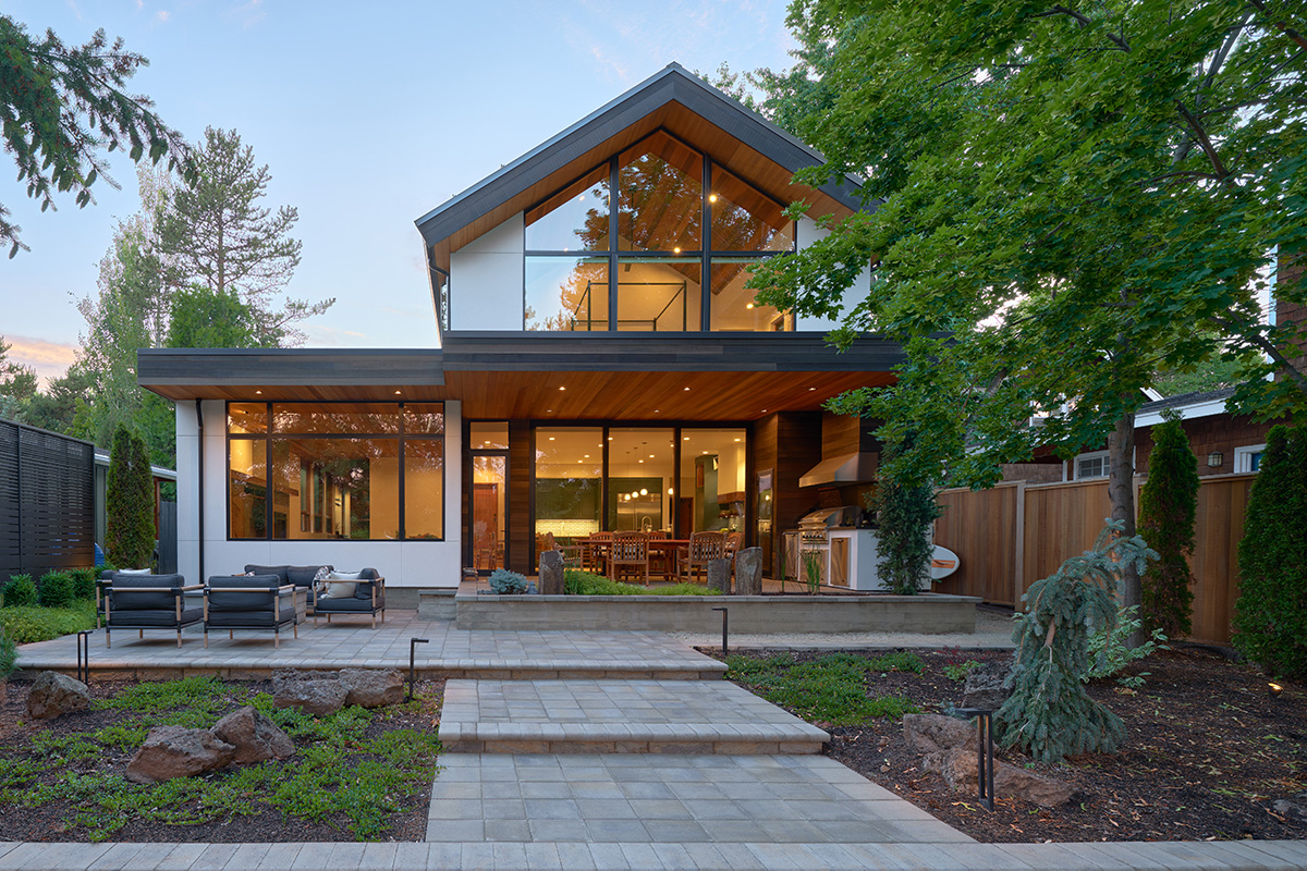 modern custom home with floor to ceiling windows on the deschutes river