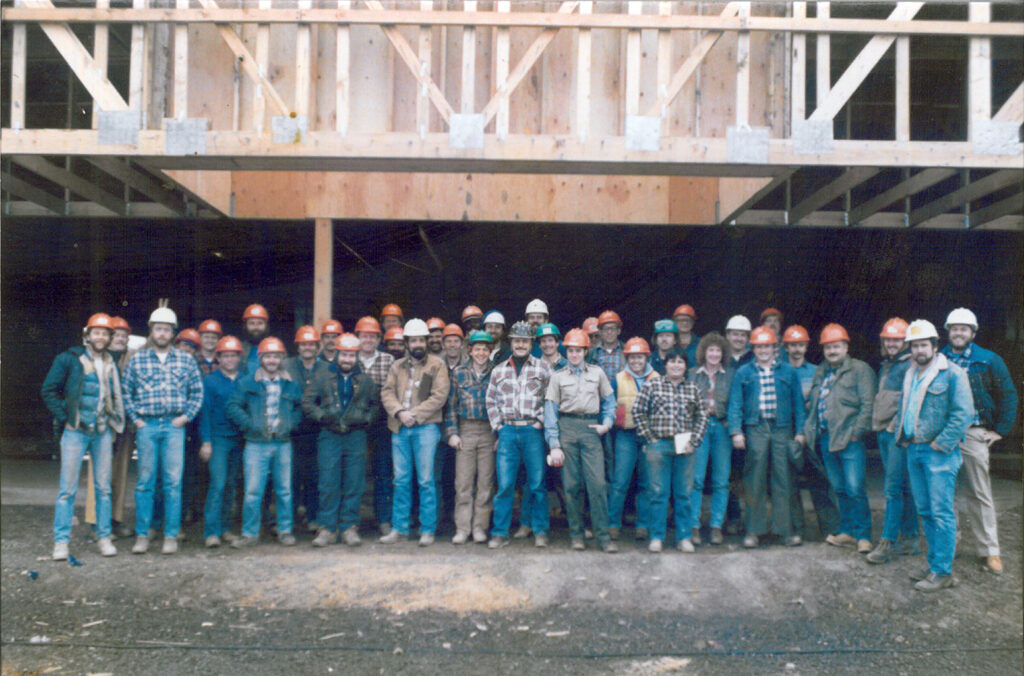 A construction crew posing for a photo